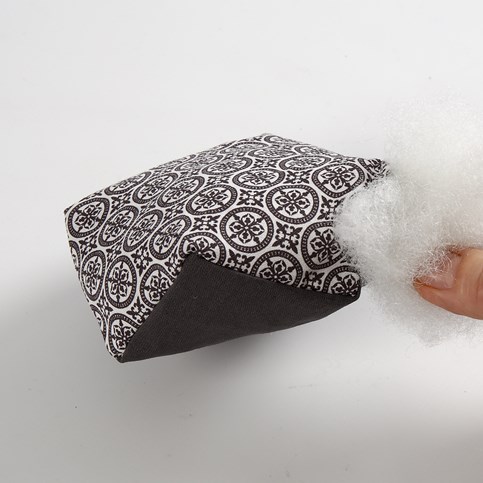 A Pincushion made from Vivi Gade Design Fabric with a Vivi Gade Design Button