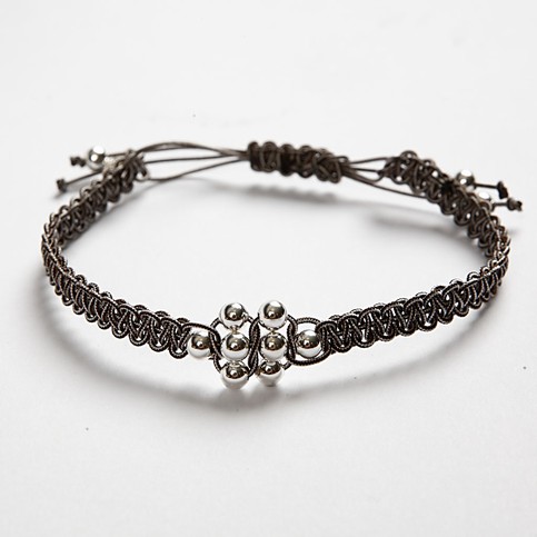 Woven whip bracelet with silver beads