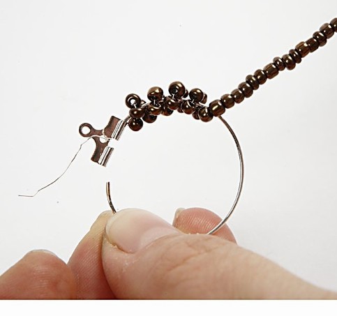 Round earrings with rocaille seed beads.