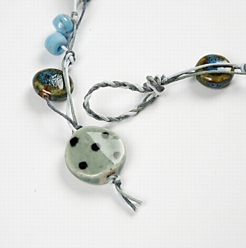 A Necklace and Bracelet with Turquoise Ceramic Beads