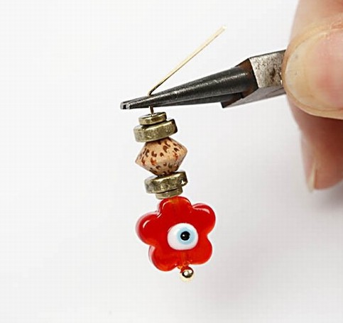 Earrings with a flower glass bead