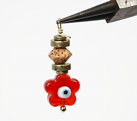 Earrings with a flower glass bead